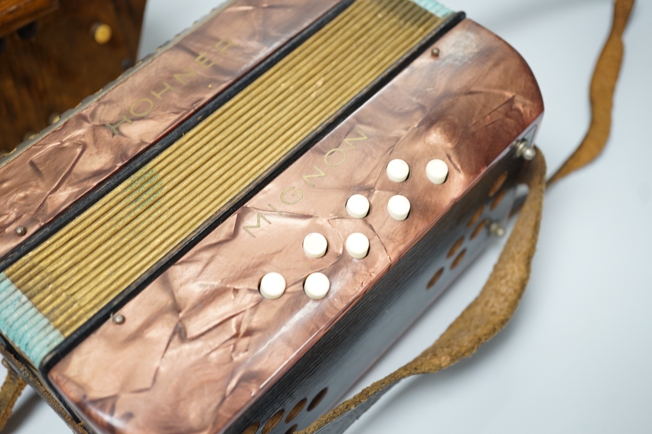 A Hohner Mignon accordion and an Empress concertina